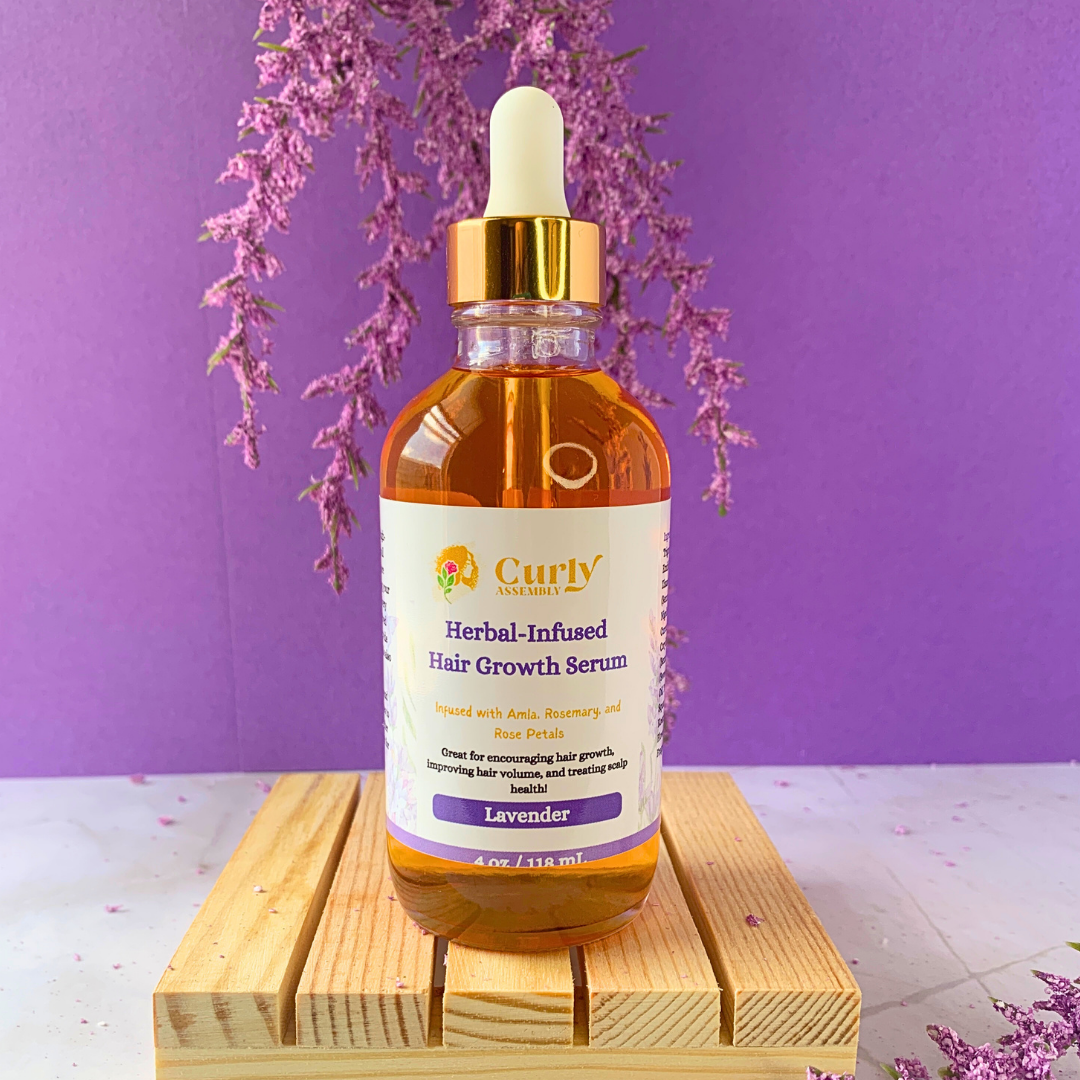 Front-facing bottle of Curly Assembly Lavender Bliss Herbal-Infused Hair Growth Serum, designed to promote hair growth and thickness.
