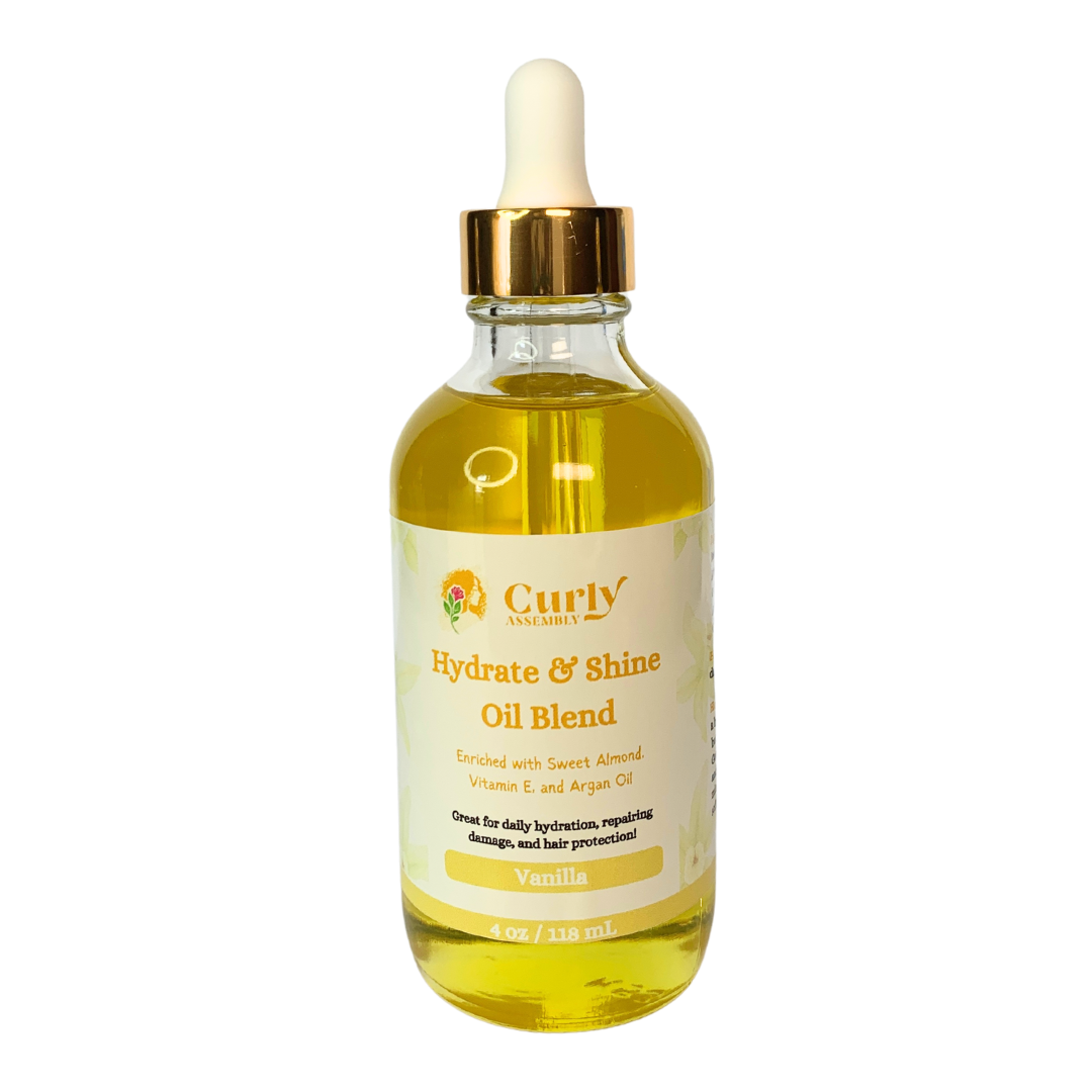 Curly Assembly Sweet Vanilla Hydrate & Shine Oil Blend bottle on a clean white background, highlighting its sleek packaging and powerful blend of natural oils that hydrate, add shine, and lock in moisture with a pleasant vanilla fragrance.