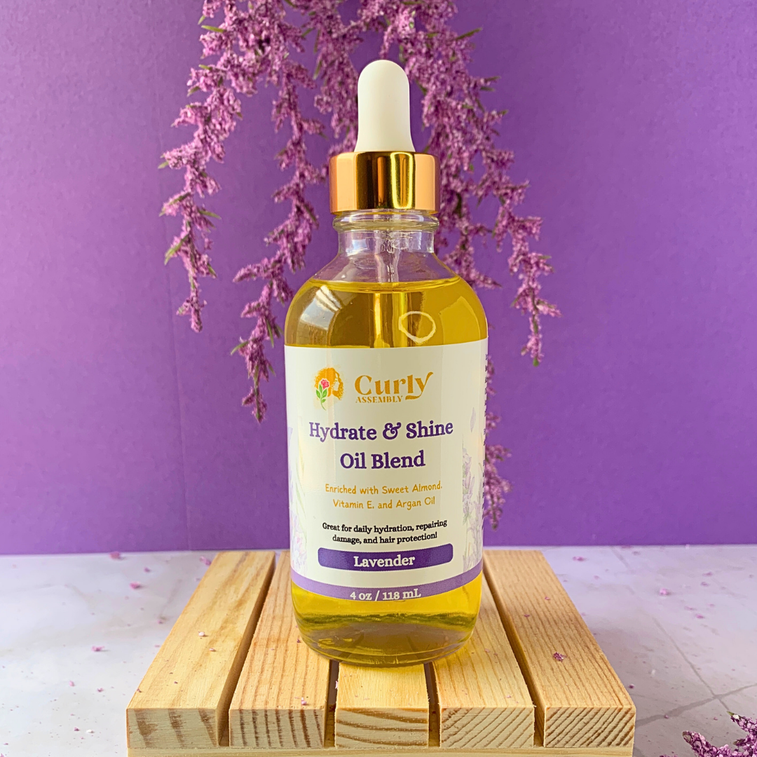 Front-facing bottle of Curly Assembly Lavender Bliss Hydrate & Shine Oil Blend for instant moisture and shine for natural curls.