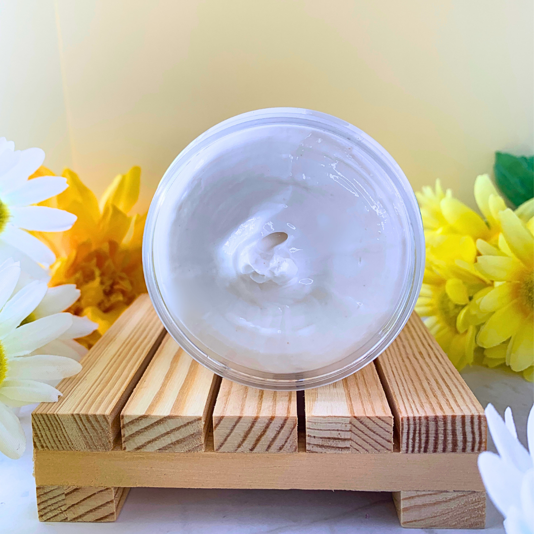 Curly Assembly Sweet Vanilla Repairing Deep Conditioner jar tilted to reveal the rich, creamy texture that deeply penetrates curly hair, delivering intense hydration, repair, and shine while leaving behind a delicate vanilla fragrance.