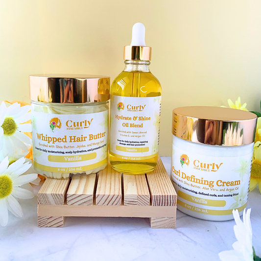 Front-facing image of Curly Assembly Trio Bundle in Sweet Vanilla, featuring Whipped Hair Butter, Hydrate & Shine Oil Blend, and Curl Defining Cream.